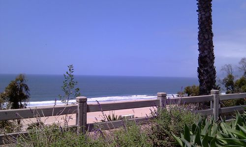 Scenic view of sea against clear blue sky