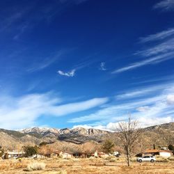 Scenic view of landscape against cloudy sky