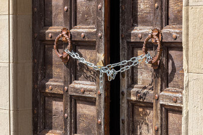 Old rusty tied up on metal door