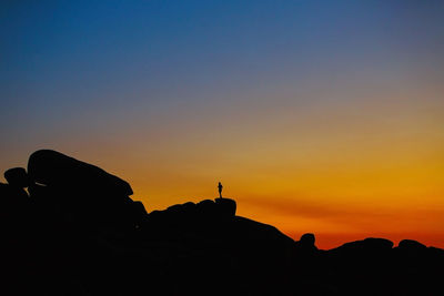 Human silhouette between cliffs-men ruz, brittany, france