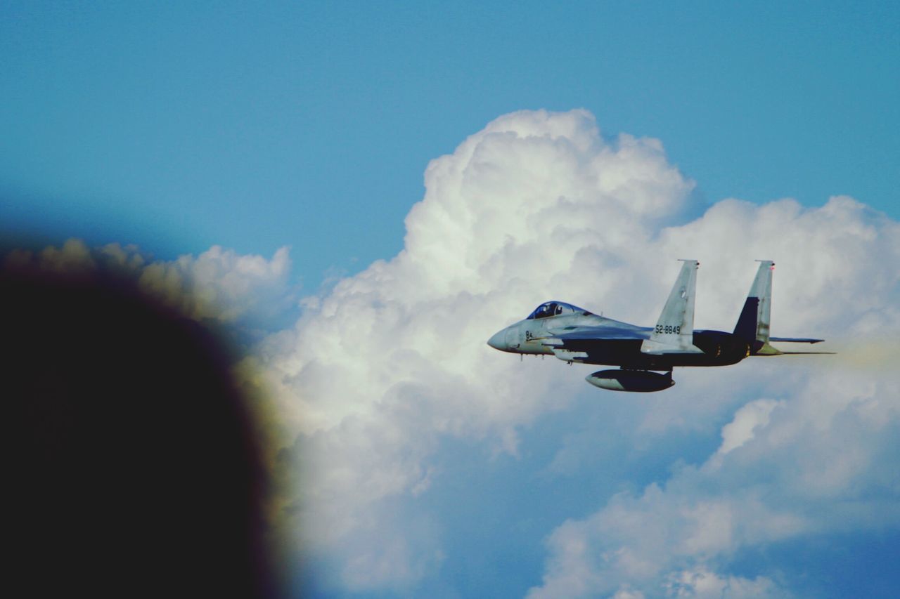 transportation, sky, mode of transport, flying, mid-air, airplane, air vehicle, cloud - sky, low angle view, blue, on the move, cloud, travel, day, adventure, outdoors, extreme sports, cloudy, journey, motion