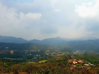 Scenic view of townscape against sky