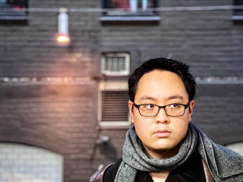 Portrait of young man standing outdoors