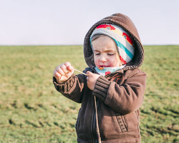 Cute girl in field during winter