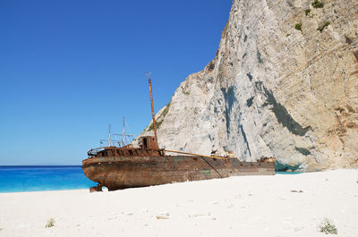 Scenic view of sea against clear blue sky