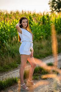 Young woman standing on field