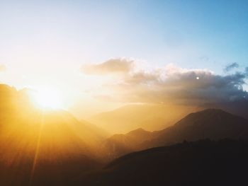 Scenic view of silhouette mountains against sky during sunset