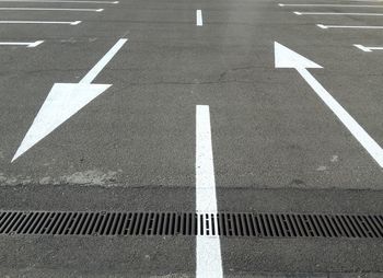 High angle view of arrow sign on road