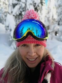 Portrait of smiling woman in snow