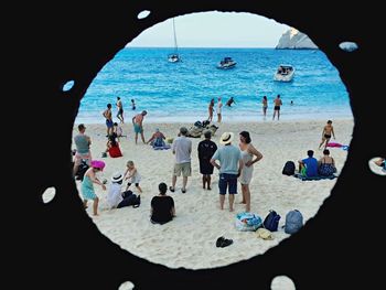 High angle view of tourists on beach