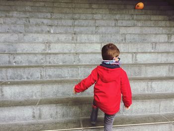 Boy standing on steps