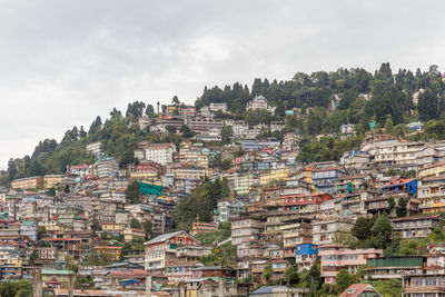 Buildings in city against sky