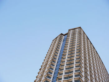 Low angle view of modern building against clear sky