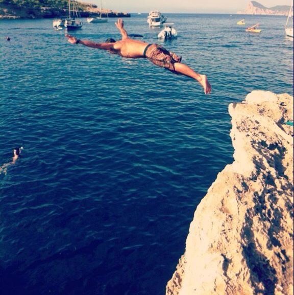 MEN JUMPING IN SEA