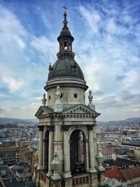 Cathedral in city against sky