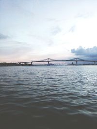 Bridge over sea against sky