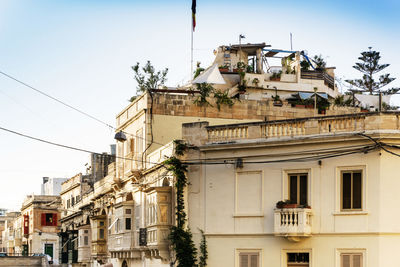 Low angle view of buildings against clear sky