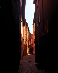 Narrow street amidst buildings in town