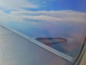 Aerial view of sky seen through airplane window