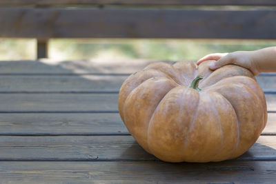 Close-up of pumpkin on wooden table