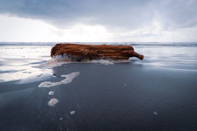 Scenic view of beach against sky