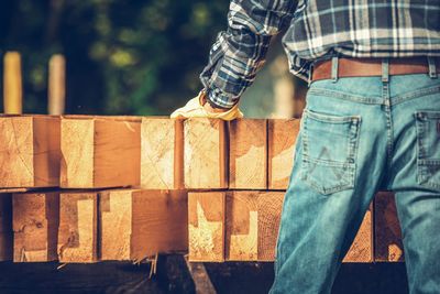 Midsection of man standing at construction site