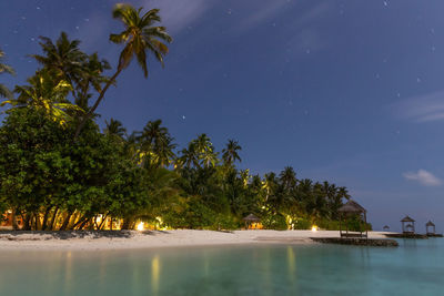 Scenic view of sea against sky at night