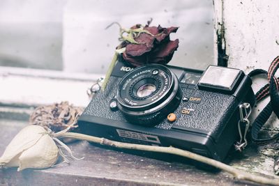 Close-up of old camera on table