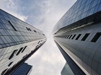 Low angle view of modern buildings against sky