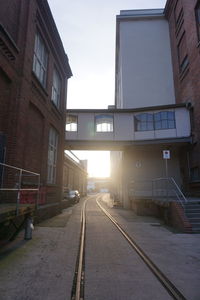 View of railroad tracks amidst buildings in city