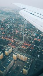 High angle view of city buildings seen through window