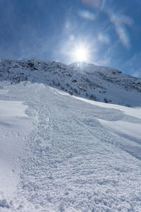 Scenic view of snowcapped mountain against sky