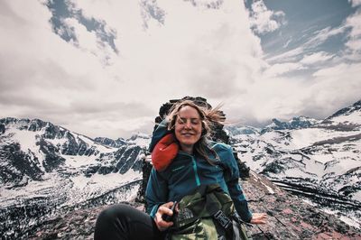 Portrait of smiling woman in snow