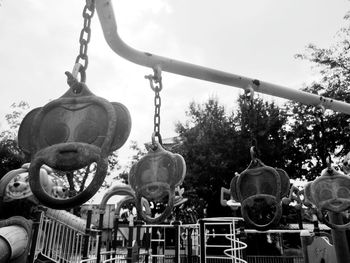 Low angle view of lanterns hanging against sky