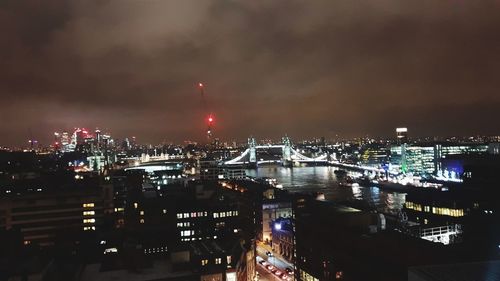 High angle view of illuminated buildings in city at night