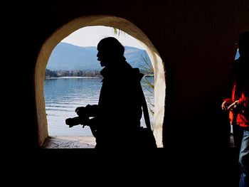 Close-up of woman sitting on bench