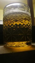 Close-up of beer glass on table