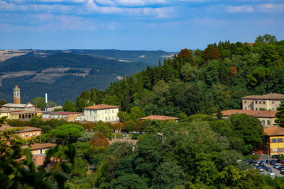 High angle view of trees and buildings against sky