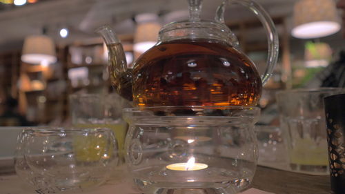 Close-up of wine glasses on table