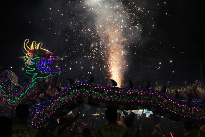 Firework display at night