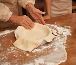 Midsection of man preparing food on table