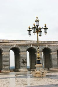 Low angle view of street light against sky