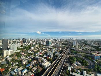 High angle view of city buildings against sky