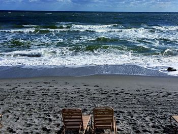 Scenic view of beach against sky