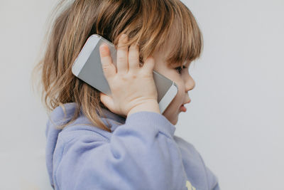 Portrait of young woman using mobile phone