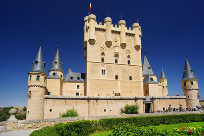 Low angle view of building against blue sky