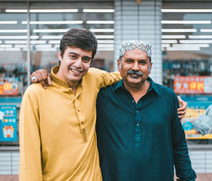 Portrait of smiling man standing in store