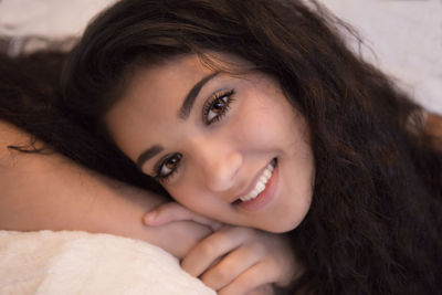 Close-up portrait of a smiling young woman