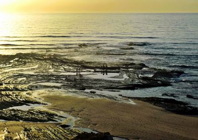 Scenic view of sea at sunset