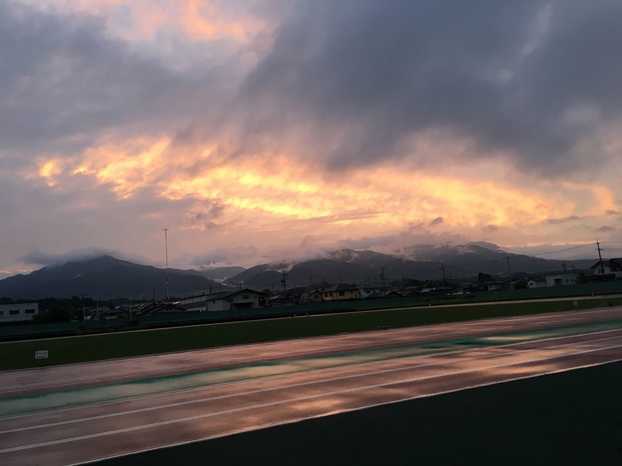 cloud - sky, sky, sunset, scenics - nature, beauty in nature, mountain, nature, no people, transportation, environment, road, landscape, storm, tranquil scene, outdoors, overcast, motion, orange color, speed